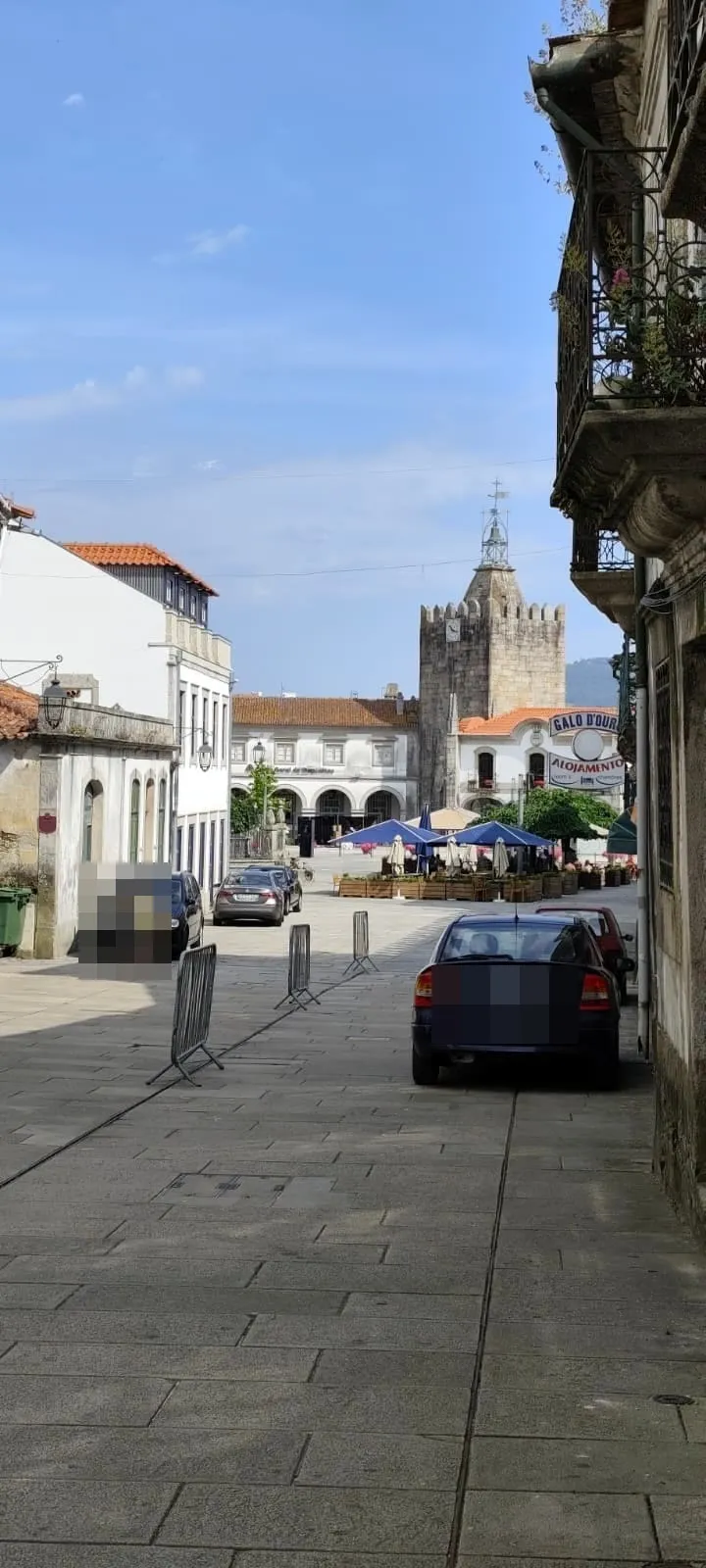 Praça Conselheiro Silva Torres in Caminha — café and restaurant terraces below the medieval Clock Tower