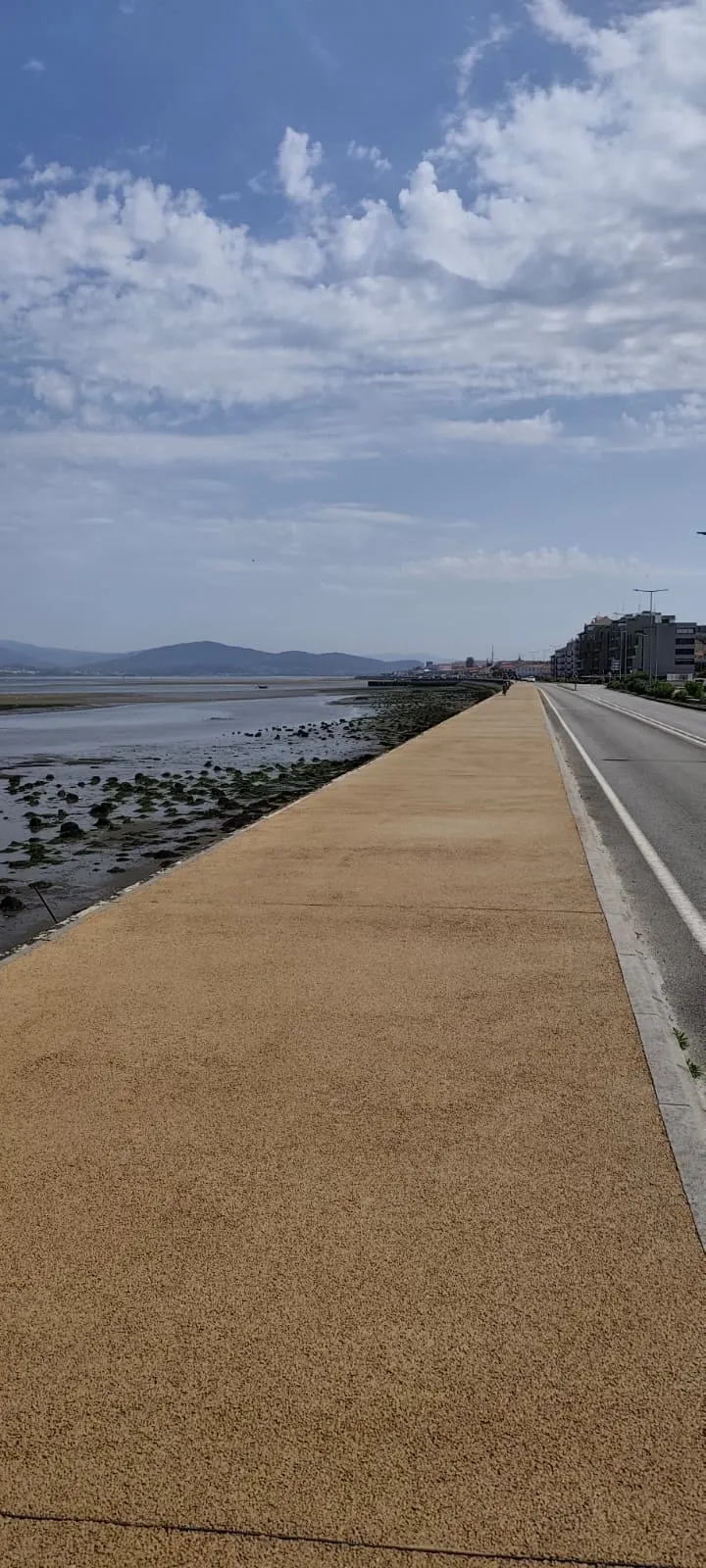 Caminha's riverside marginal on the Rio Minho — the waterfront where most central albergues and guesthouses sit